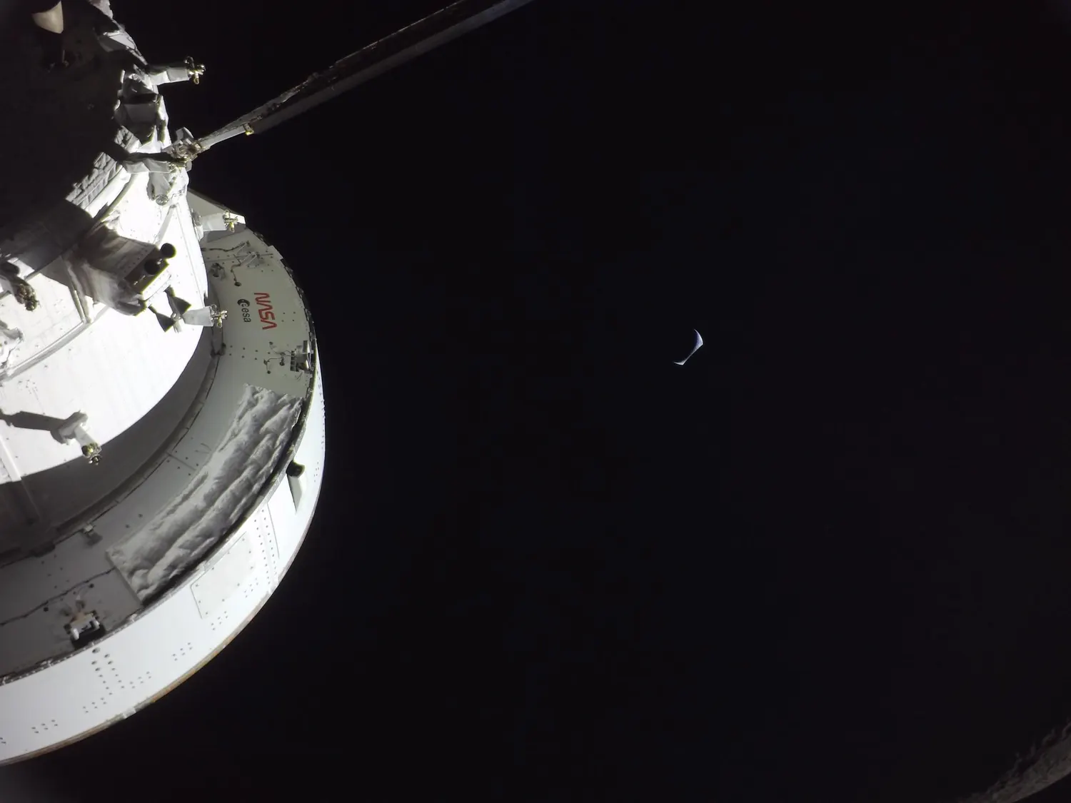 Earth rising above the lunar horizon, photographed from the Orion spacecraft.