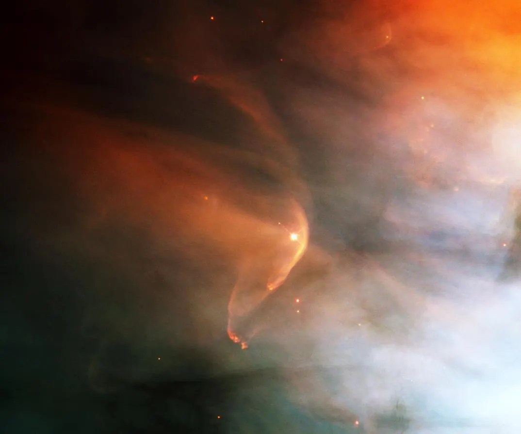 The Orion Nebula, a vast glowing cloud of gas and dust where new stars are forming.
