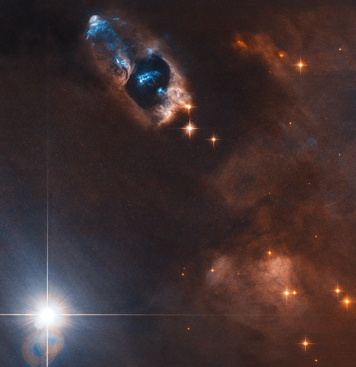 A newborn star firing narrow jets of gas into the surrounding nebula.